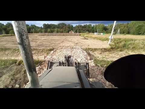Видео: Будни машиниста. Планировка участка экскаватором-погрузчиком