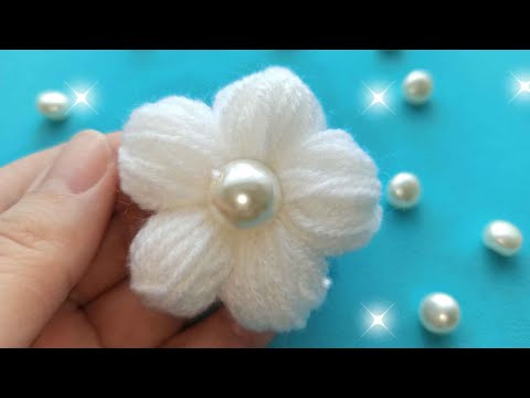 Видео: Цветы из пряжи без спиц и крючка/thread flowers with your finger