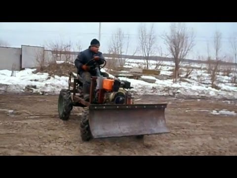 Видео: Самодельный отвал на минитрактор