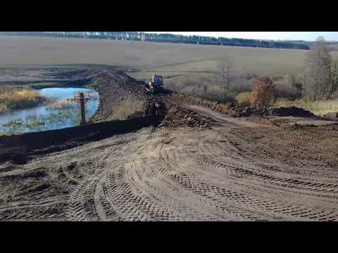 Видео: Постройка плотины. Работа скрепера.