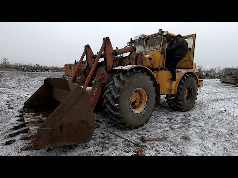 Видео: К 701. Меняем ковш на отвал...