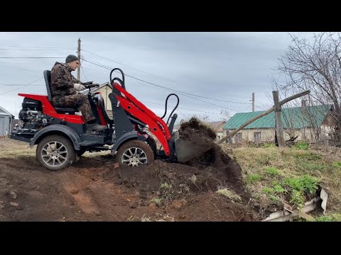 Видео: Планировка грунта на мини погрузчике IRSA