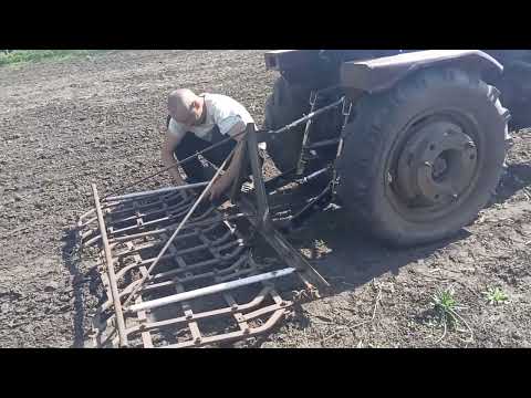 Видео: Бороню огород на мини тракторе Xingtai 120