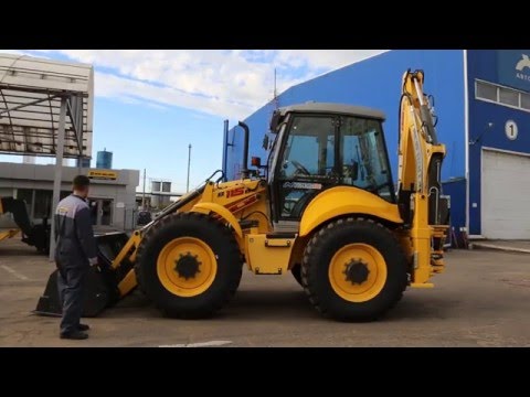 Видео: Обзор экскаватора погрузчика New Holland B115B