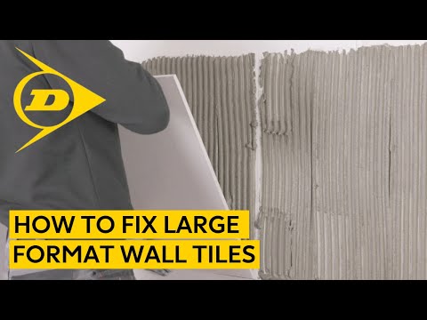 Видео: Как крепить настенную плитку большого формата