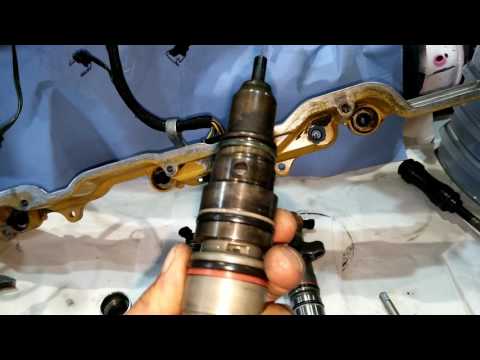 Видео: Техпривет. Cat C9. Замена стаканов форсунок.