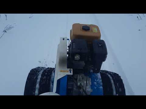Видео: мотоблок нева мб 23 на гусеницах с дровами