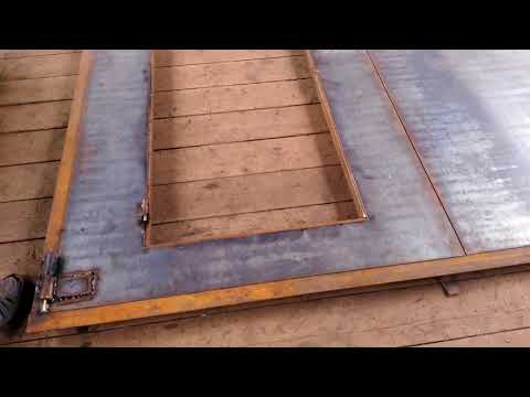 Видео: Гаражные ворота (утепленные, с контейнерным запором). Garage Doors (insulated, with container lock)