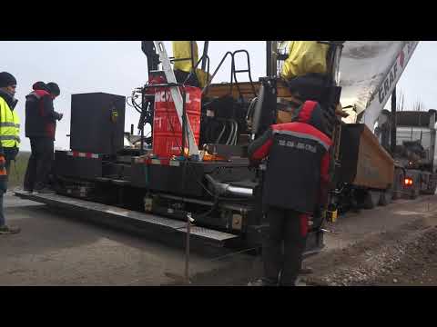 Видео: Асфальтоучладчки SANY