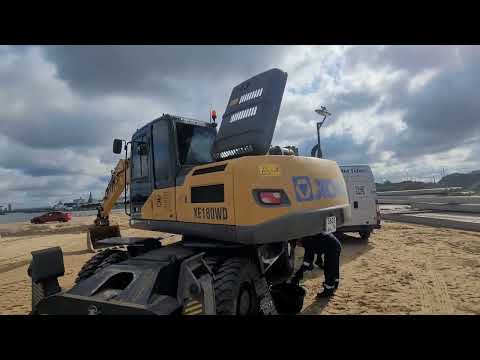 Видео: Экскаватор XCMG xe180wd проблемы с мотором, Работа колёсного экскаватора XCMG xe180wd.  Нулевое ТО.