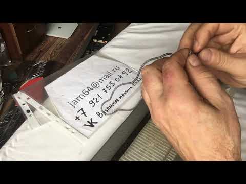 Видео: Замена подигольной пружины на Неве-5