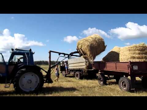 Видео: Погрузка рулонов самодельной стрелой