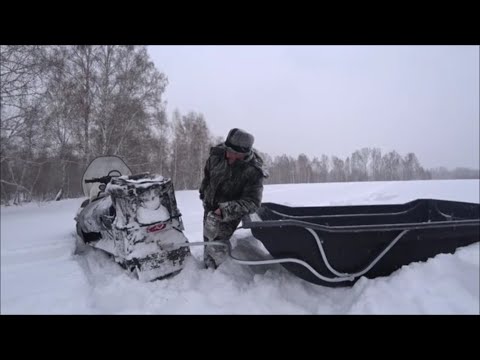 Видео: Тайга варяг 550 с Огромными санями. Расход и движение.