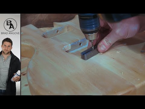 Видео: Как просверлить отверстия под наконечники струн без сверлильного станка