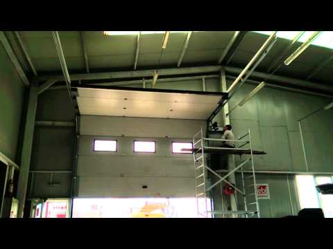 Видео: Гаражни врати Техноматика Експеримент с претоварване на страничен мотор за секционни врати