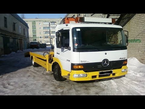 Видео: Замена передних тормозных колодок Mercedes Atego