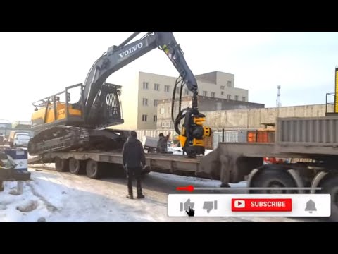 Видео: Вольво EC220DL гусеничный харвестер погрузка на трал