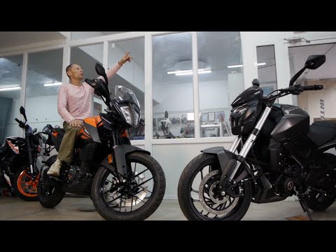 Видео: Bajaj Dominar 400 vs KTM 390 Adventure| Разбор эксперта: надежный крепыш или универсальный спортбайк