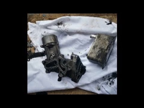 Видео: Замена прокладок маслостакана и теплообменника М57