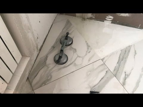 Видео: Как отрезать плитку в углу