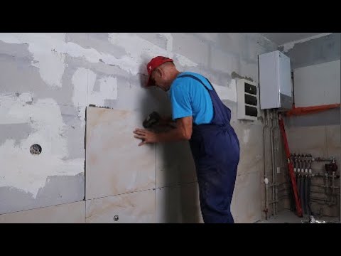 Видео: Укладка плитки в ванной прямо на блоки, без штукатурки ч.12