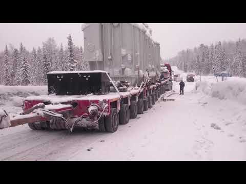 Видео: При перевозки трансформатора 96 тонн.  Прохождение над мостом через речку с помощью МПС.