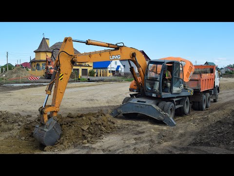 Видео: Экскаватор Эксмаш UMG E170W. Работа.