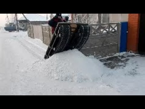 Видео: Бортоповоротный снегоход Сибирь