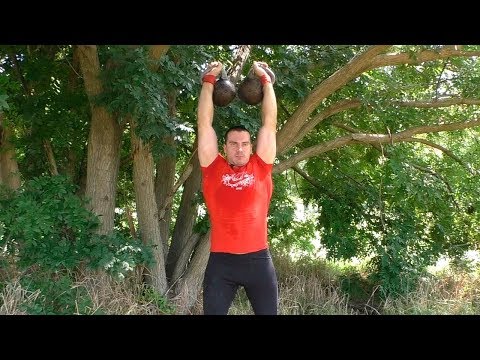 Видео: Жим гирь стоя: техника и нюансы