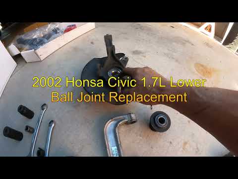 Видео: Замена нижнего шарового шарнира Honda Civic 1 7L 2002 года