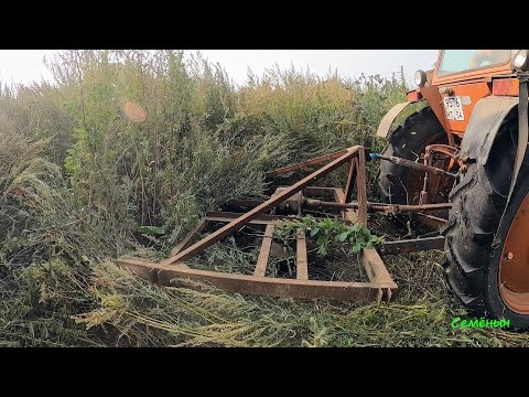 Видео: Боремся с сорняками выше человеческого роста. Вывозим рулоны сена. Самодельный триммер для трактора.