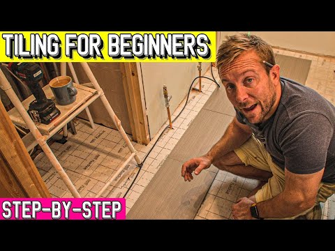 Видео: Укладка плитки на пол в ванной для начинающих