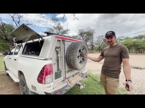 Видео: Обзор Toyota Hilux для путешествий, кунг экспедиционный и палатка, в Намибии