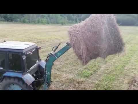 Видео: Вывоз сена на МТЗ 80, погрузка рулонов самодельной стрелой в 2 птс 4 сенокос 2021