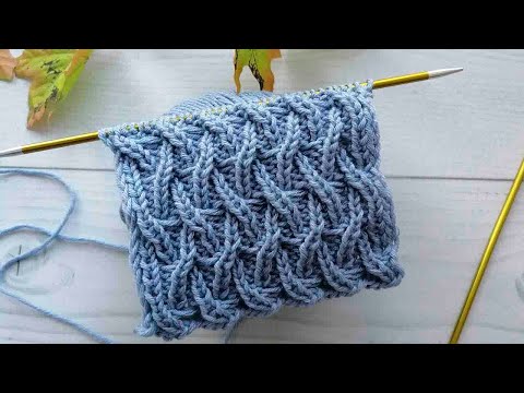 Видео: Великолепный плетеный узор спицами