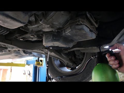 Видео: Частичная замена масла в АКПП на Volkswagen Tiguan 2,0 Фольксваген Тигуан 2009 год