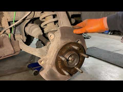 Видео: Dodge Ram 1500 4x4 2006 года: замена подшипника передней ступицы