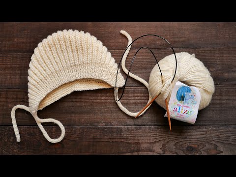 Видео: Шапочка чепчик пышной резинкой спицами 🦢 Pattern baby bonnet