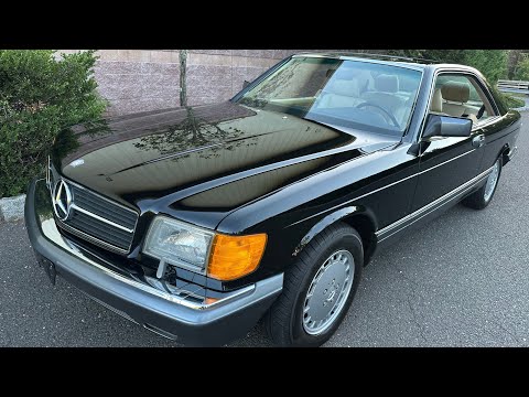 Видео: Mercedes-Benz 560SEC 1991 года с пробегом менее 28 тыс. миль, цвет черный 040 на бежевом, 10.04.2025