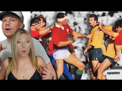 Видео: Она НЕ МОЖЕТ ПОВЕРИТЬ, ЧТО ЭТО НАЗВАЛИ РЕГБИ! Пара реагируют на эпоху регбийных хулиганов старой ...