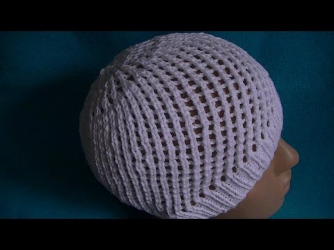 Видео: Вязание ажурной шапочки на круговых спицах.Knitting lace cap on circular needles.