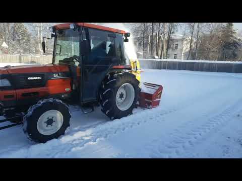 Видео: Минитрактор Kubota работа снегоротора