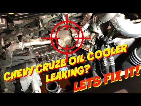 Видео: Замена уплотнителей/прокладок масляного радиатора Chevy Cruze — Устранение течи масла — Запах гор...