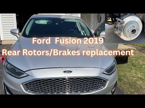 Видео: Как заменить задние роторы и тормоза на Ford FUSION HYBRID 2019