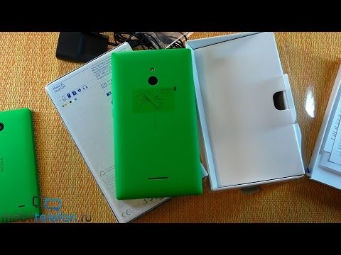 Видео: Распаковка Nokia XL: запуск и комплектация (unboxing)