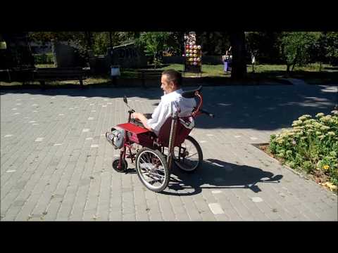 Видео: инвалидная коляска с мотор колесом.