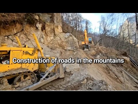 Видео: Construction of a new road in the mountains.Строительство новой дороги в горах.