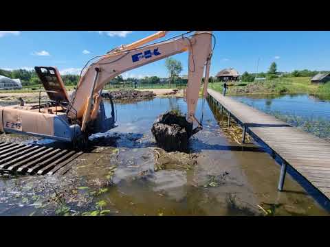 Видео: Экскаватор амфибия