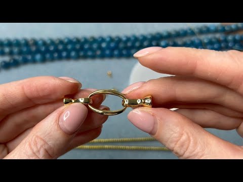 Видео: Как прикрепить замок к бусам.