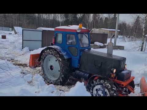 Видео: Чистка мокрого снега на т40ам.